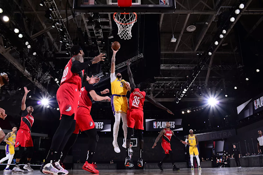 Anthony Davis (3) puts back up a heavily contested floater in Game 2 of the 2020 NBA Playoffs,