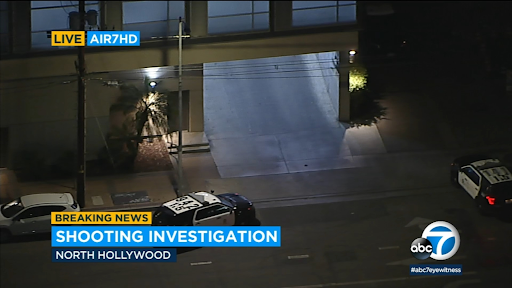 Screencap of News reporting from abc news, site where a man was shot and found in a parking garage of a high-rise apartment complex, located in North Hollywood.