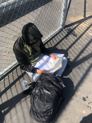 A student works on their homework during school nutrition.