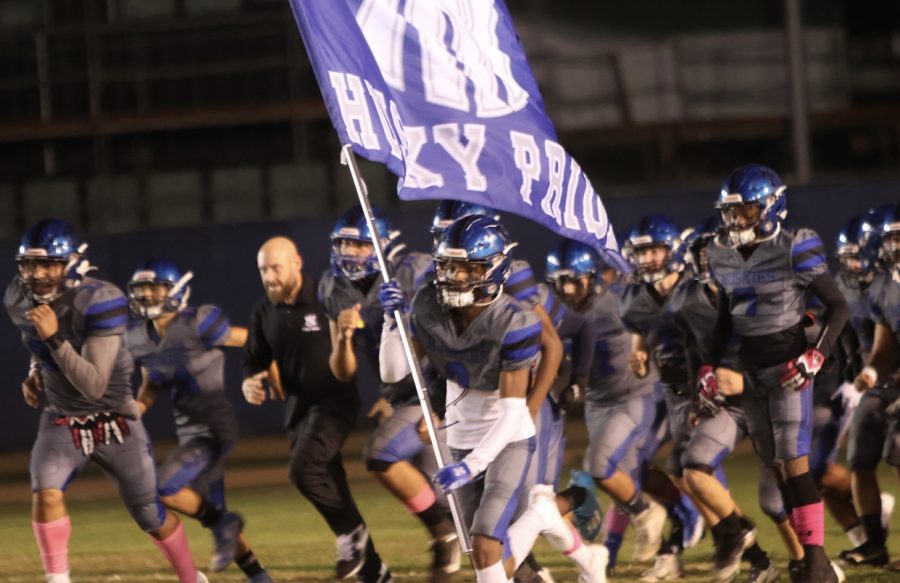 The North Hollywood Huskies running through the field at their last game of leagues against Verdugo Hills the week before playoffs