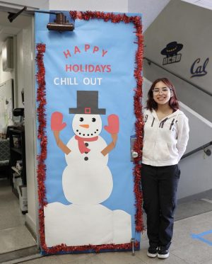 Victoria Bonola a NHHS Senior wishing everyone happy holidays. Photo Courtesy of @nohohusky.