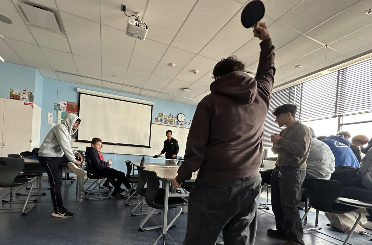 Dael Song and Chris Renteria engage in a round of ping pong