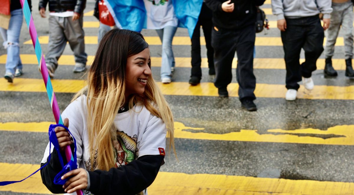 Jennifer Garcia hitting a Pinata during school Immigration protest 