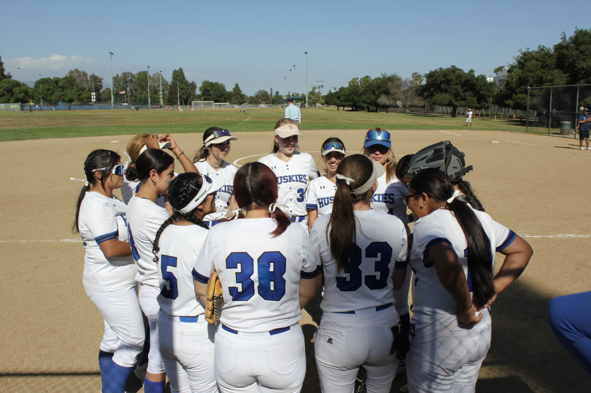 Lady Huskies huddle together to create a game plan for their home game against Sylmar High School 