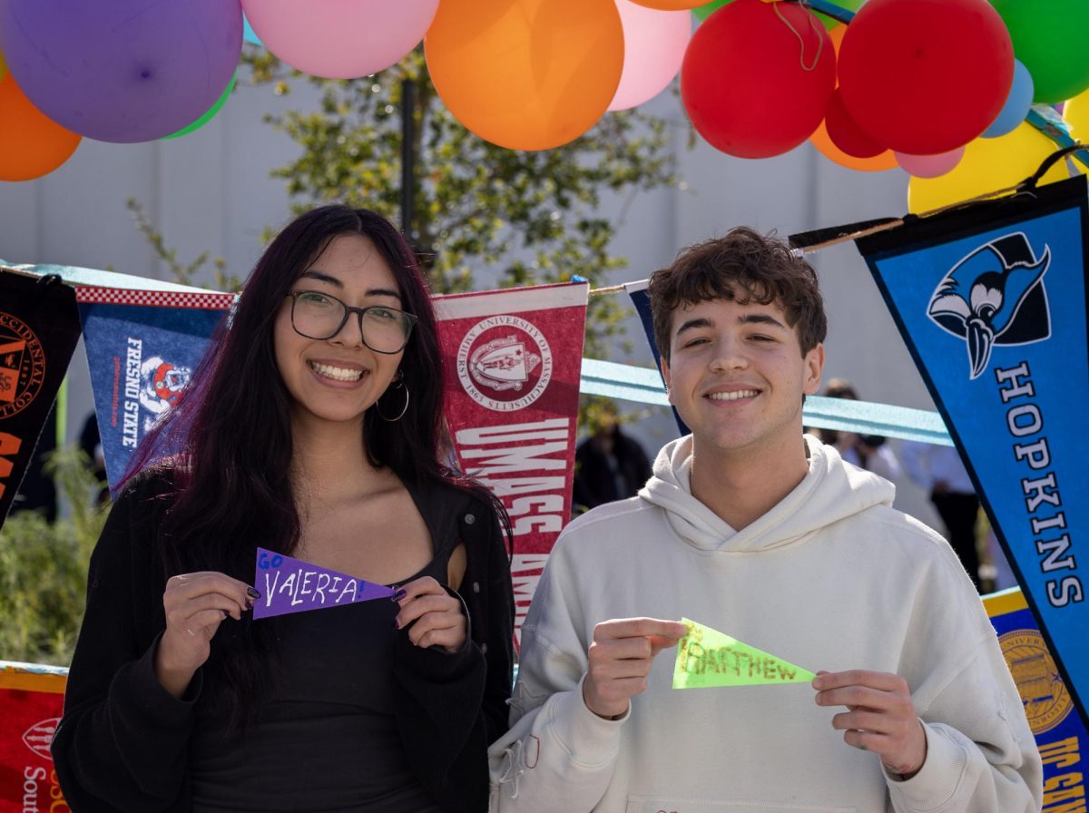 Seniors Valeria Samano and Benjamin Rodda enjoy the 'I Submitted' event after months of hard work on college applications. (Olivia Reed) 