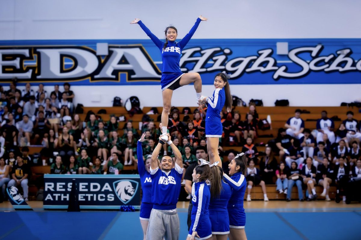 North Hollywood High School’s Cheer team performs their high energy routine, competing as Co-Ed Varsity Small at Reseda High School 