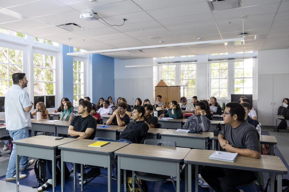 Mr. Barragan teaching a lecture for his Honors U.S. Government classroom of Seniors (12). 