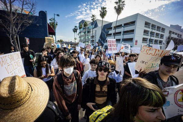 Students from several schools march down Magnolia Blvd. protesting against I.C.E.