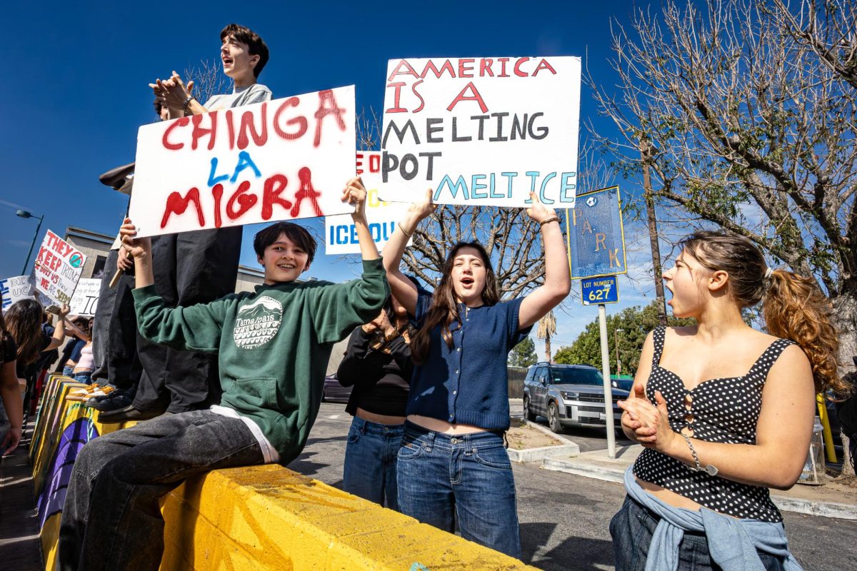 Students hold protest signs and chant during the All Valley Walk Out on Feb. 6 at the intersection of Magnolia Boulevard and Lankershim Boulevard in the San Fernando Valley, Calif. Students from schools across the valley walked out of class and marched toward Van Nuys City Hall to protest immigration enforcement policies and show youth support for immigrant communities.