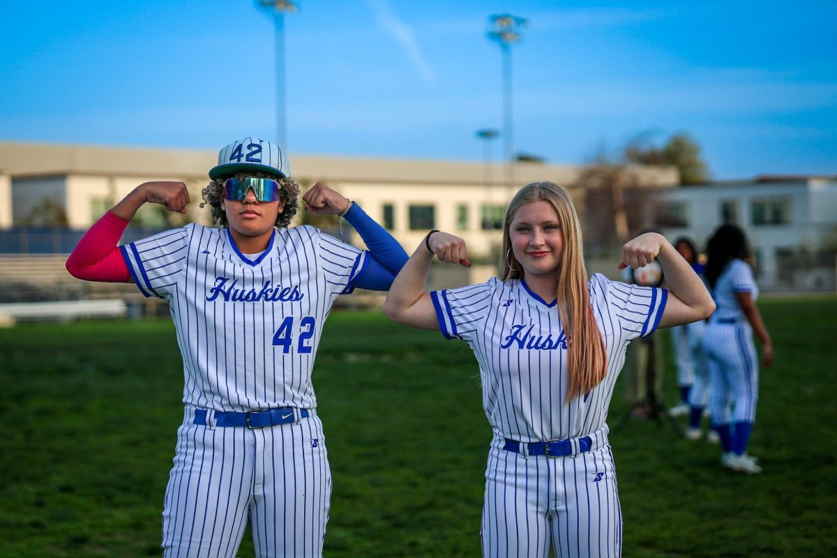 Kennedy Jones and Fisher Hinnen flex their muscles, showing off their hard work and dedication during media day, ready to dominate the spring sports season.