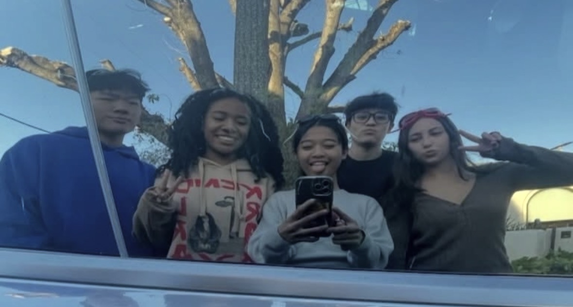 Team "WAB Gang," Sean Lee, Isabella Batts, Angelica Cabral and Rebecca Maya collectively gather to hunt down their senior assassin targets.