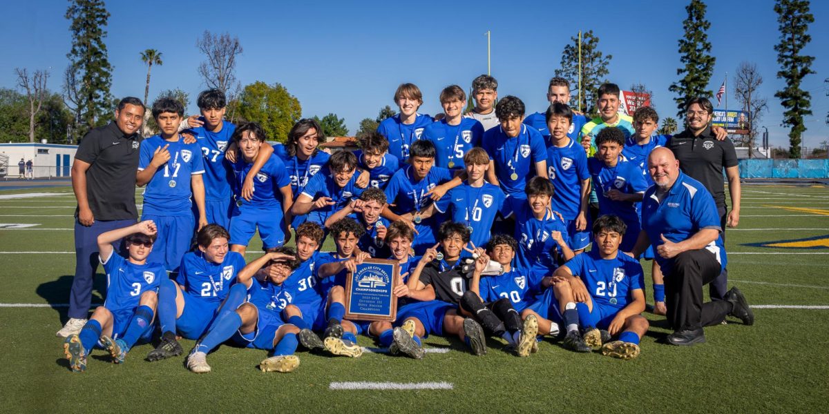After a memorable, first CIF win in NHHS boys soccer history, team members pose as the proudly show of their D3 LA City Championship plaque. 