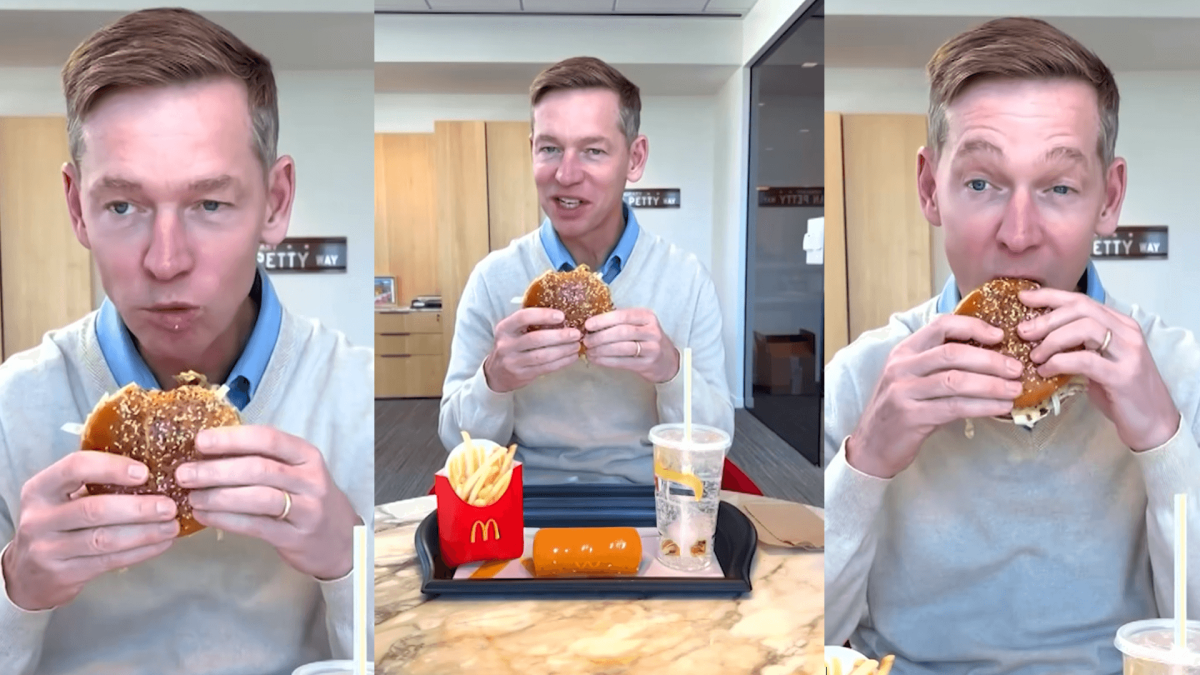 Chris Kempczinski, the CEO of McDonald’s, tastes his latest food item, the "Big Arch". Kempczinski raises controversy against Mc Donald's food quality as his expression lacks in satisfaction.