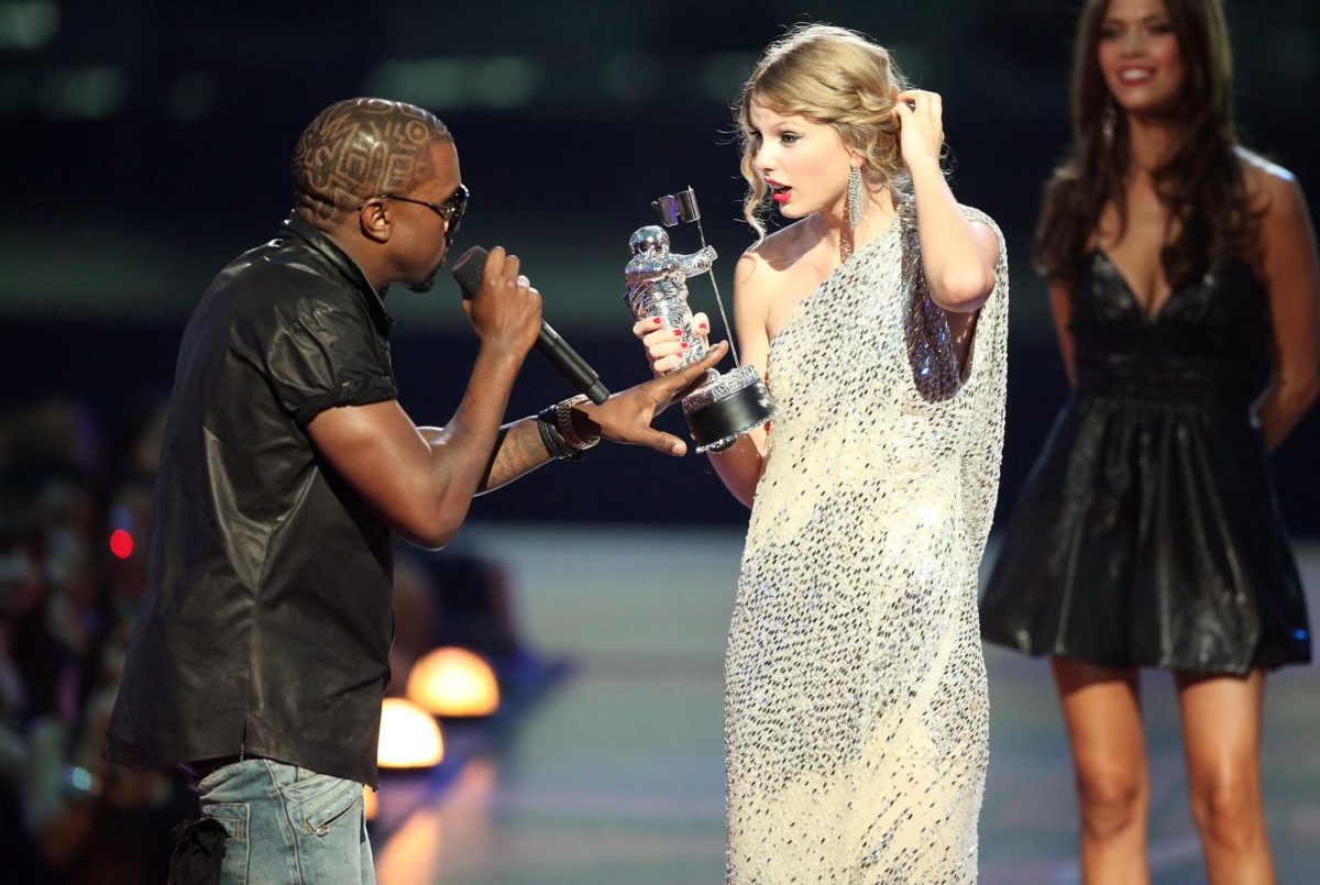 Kanye West confronts Taylor Swift as she receives a VMA. (Photo by Christopher Polk/Getty Images)