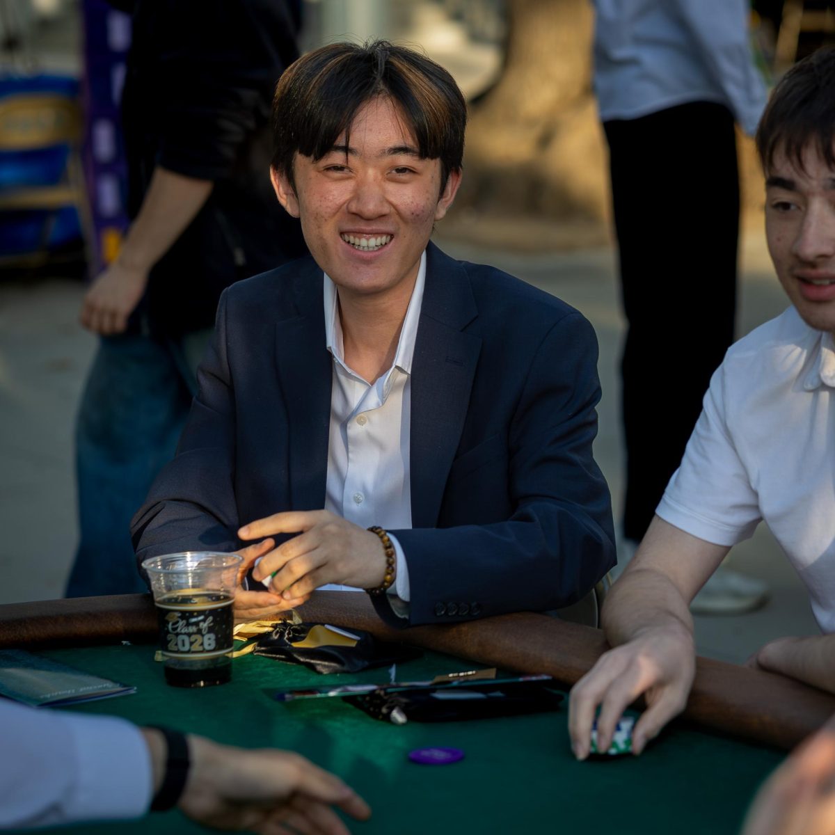 Suzuko Oshima smiles in delight at the poker table.
